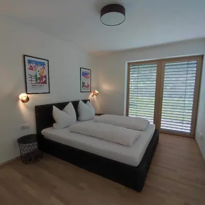Ein Bett oder Betten in einem Zimmer der Unterkunft Apart Loris