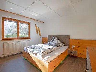 Ein Bett oder Betten in einem Zimmer der Unterkunft Exclusive apartment with garden and whirlpool