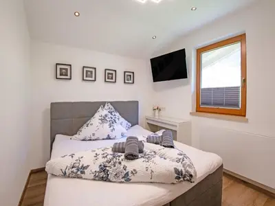 Ein Bett oder Betten in einem Zimmer der Unterkunft Exclusive apartment with garden and whirlpool