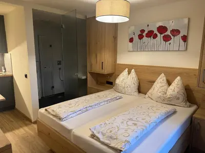 Ein Bett oder Betten in einem Zimmer der Unterkunft Bergblick