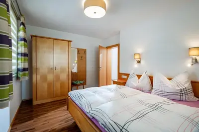 Ein Bett oder Betten in einem Zimmer der Unterkunft Apartmenthaus Stefan