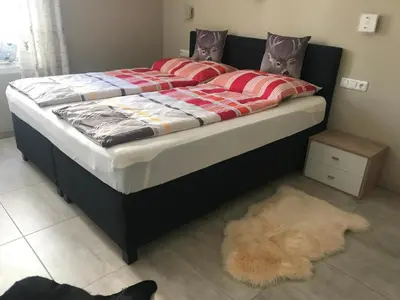 Ein Bett oder Betten in einem Zimmer der Unterkunft Kössen Dorf41 TOP1
