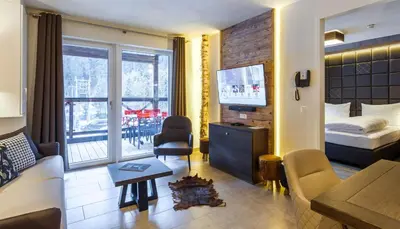 Ein Bett oder Betten in einem Zimmer der Unterkunft AvenidA Mountain Lodges Saalbach