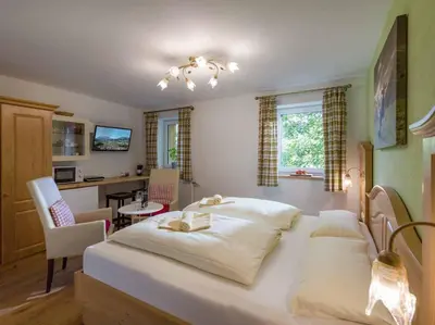 Ein Bett oder Betten in einem Zimmer der Unterkunft Alpenresidenz Fieberbrunn