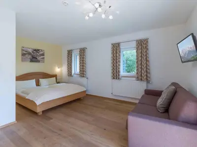 Ein Bett oder Betten in einem Zimmer der Unterkunft Alpenresidenz Fieberbrunn
