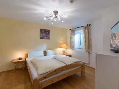 Ein Bett oder Betten in einem Zimmer der Unterkunft Alpenresidenz Fieberbrunn