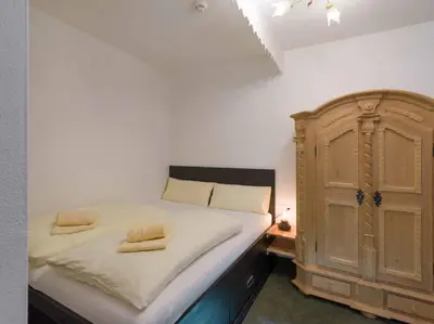 Ein Bett oder Betten in einem Zimmer der Unterkunft Alpenresidenz Fieberbrunn