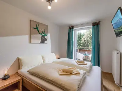 Ein Bett oder Betten in einem Zimmer der Unterkunft Alpenresidenz Fieberbrunn