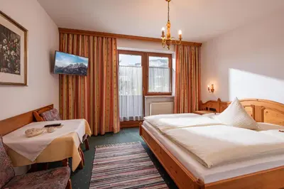 Ein Bett oder Betten in einem Zimmer der Unterkunft Pension Obermoser