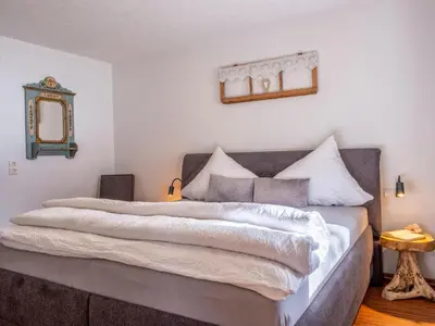 Ein Bett oder Betten in einem Zimmer der Unterkunft Alpenglück
