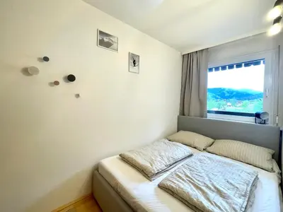 Ein Bett oder Betten in einem Zimmer der Unterkunft An der Gondel - Haus Thalgau