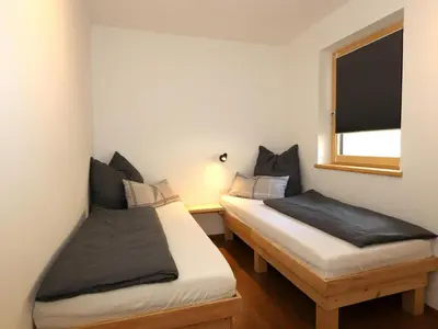 Ein Bett oder Betten in einem Zimmer der Unterkunft Stoanerhof