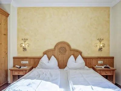 Ein Bett oder Betten in einem Zimmer der Unterkunft Bergzeit Fieberbrunn