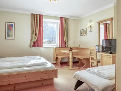 Ein Bett oder Betten in einem Zimmer der Unterkunft Bergzeit Fieberbrunn
