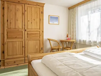 Ein Bett oder Betten in einem Zimmer der Unterkunft Bergzeit Fieberbrunn