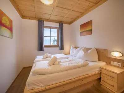 Ein Bett oder Betten in einem Zimmer der Unterkunft Chalet in Königsleiten near Zillertal Ski Area