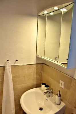 Ein Badezimmer in der Unterkunft Tennladen Apartments