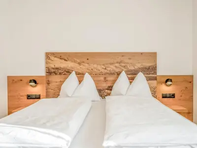 Ein Bett oder Betten in einem Zimmer der Unterkunft Helfensteinblick
