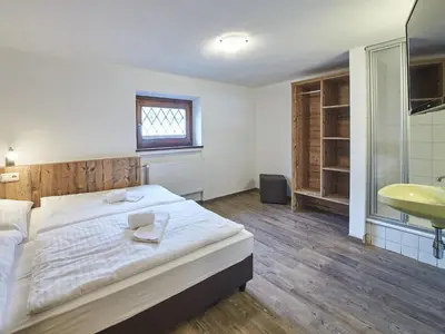 Ein Bett oder Betten in einem Zimmer der Unterkunft Chalet Fabian by we rent, JOKERCARD INCLUDED