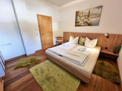 Ein Bett oder Betten in einem Zimmer der Unterkunft Appartement Berghof 