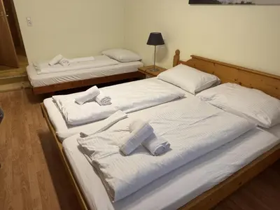 Ein Bett oder Betten in einem Zimmer der Unterkunft Alpenlodge, Ferienwohnung 16