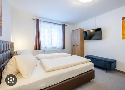 Ein Bett oder Betten in einem Zimmer der Unterkunft Rupertihof