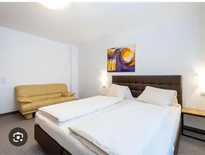 Ein Bett oder Betten in einem Zimmer der Unterkunft Rupertihof