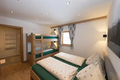 Ein Bett oder Betten in einem Zimmer der Unterkunft Vorderbichlhof Urlaub am Bauernhof