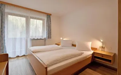 Ein Bett oder Betten in einem Zimmer der Unterkunft Gasthof Appartement`s Staffnerhof