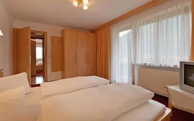 Ein Bett oder Betten in einem Zimmer der Unterkunft Gasthof Appartement`s Staffnerhof