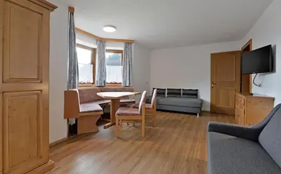 Ein Sitzbereich in der Unterkunft Gasthof Appartement`s Staffnerhof