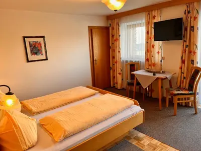 Ein Bett oder Betten in einem Zimmer der Unterkunft Pension Haidachhof