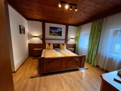 Ein Bett oder Betten in einem Zimmer der Unterkunft Pension Haidachhof