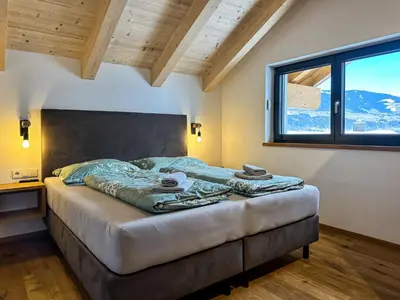 Ein Bett oder Betten in einem Zimmer der Unterkunft Ours Living Penthaus - inkl private Sauna