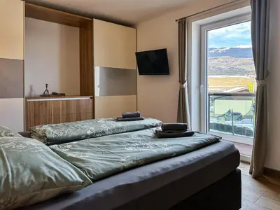 Ein Bett oder Betten in einem Zimmer der Unterkunft Ours Living Kitzbüheler Alpen - inkl Sauna