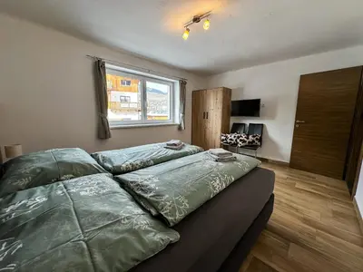 Ein Bett oder Betten in einem Zimmer der Unterkunft Ours Living Kitzbüheler Alpen - inkl Sauna