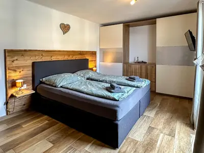 Ein Bett oder Betten in einem Zimmer der Unterkunft Ours Living Kitzbüheler Alpen - inkl Sauna