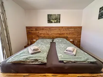 Ein Bett oder Betten in einem Zimmer der Unterkunft Ours Living Kitzsteinhorn Gletscher - inkl Sauna