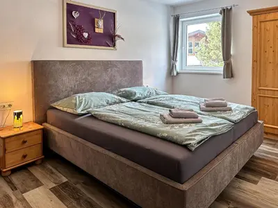 Ein Bett oder Betten in einem Zimmer der Unterkunft Ours Living Venedigerblick - inkl Sauna
