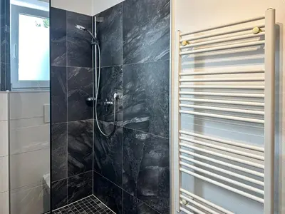 Ein Badezimmer in der Unterkunft Ours Living Venedigerblick - inkl Sauna