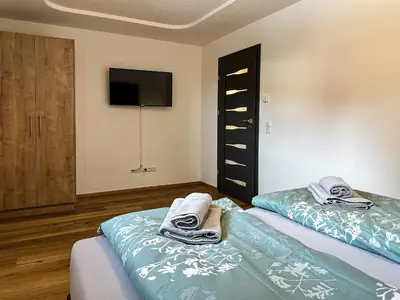 Ein Bett oder Betten in einem Zimmer der Unterkunft Ours Living Larmkogel - inkl Sauna