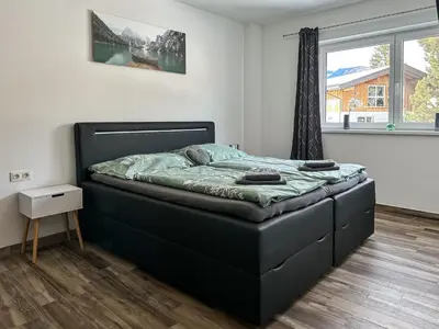 Ein Bett oder Betten in einem Zimmer der Unterkunft Ours Living Tauernkogel - inkl Sauna