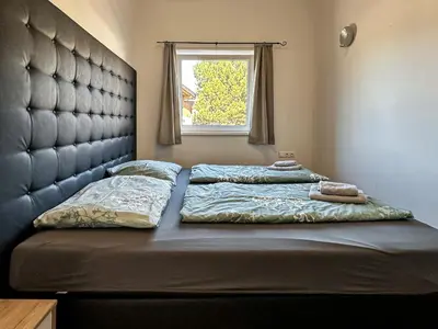 Ein Bett oder Betten in einem Zimmer der Unterkunft Ours Living Pihapper Blick - inkl Sauna