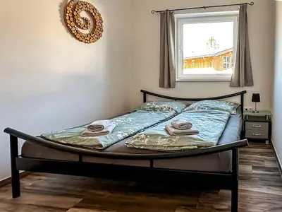 Ein Bett oder Betten in einem Zimmer der Unterkunft Ours Living Pihapper Blick - inkl Sauna