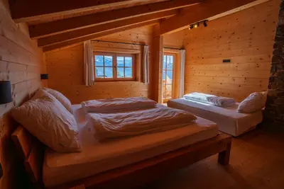Ein Bett oder Betten in einem Zimmer der Unterkunft Mountain Lodge Stummerberg