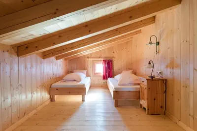 Ein Bett oder Betten in einem Zimmer der Unterkunft Sennhütte Mitterplatt'n