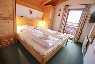 Ein Bett oder Betten in einem Zimmer der Unterkunft Chalet 155 - Hochkrimml