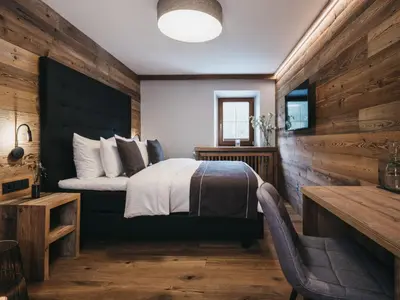 Ein Bett oder Betten in einem Zimmer der Unterkunft VAYA Post Saalbach Landhaus