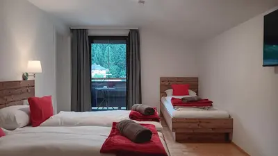Ein Bett oder Betten in einem Zimmer der Unterkunft Haus Huber Zimmer und Apartments