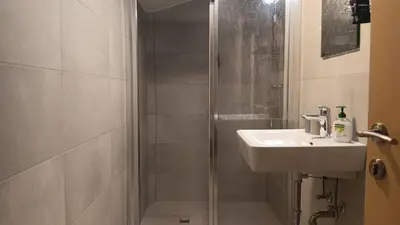 Ein Badezimmer in der Unterkunft Haus Huber Zimmer und Apartments